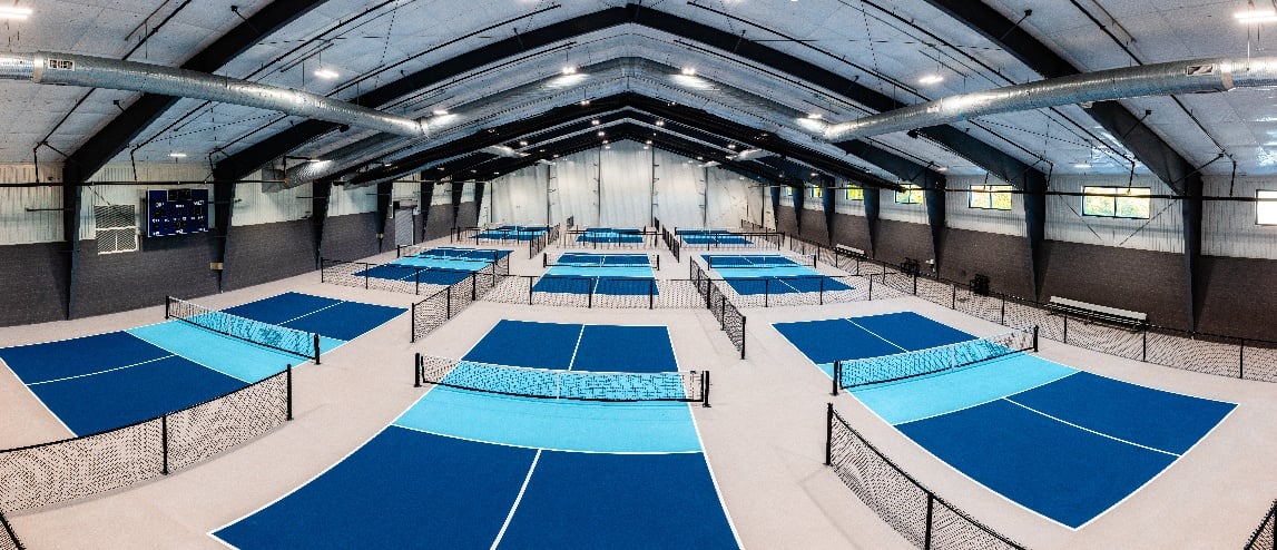 panoramic view of indoor pickleball courts